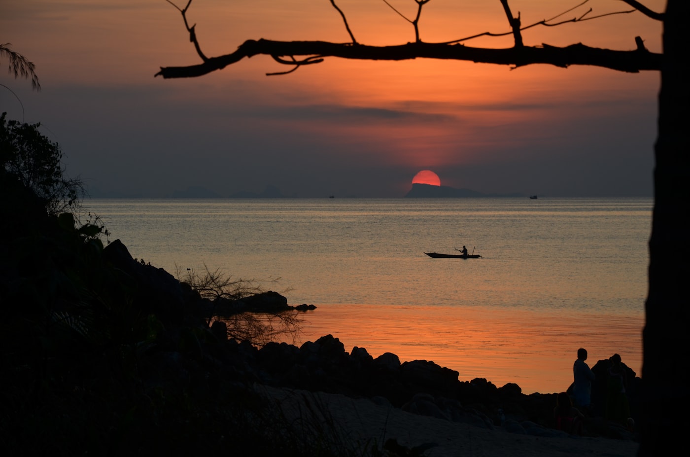 The sun setting over a calm sea off the west coast of Koh Samui